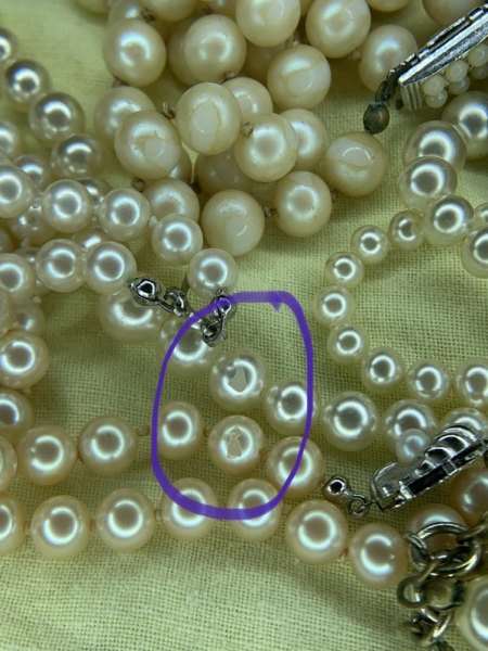 Perlenketten obere Schicht löst sich