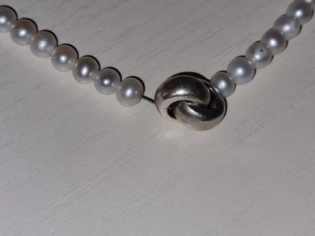 Perlenkette Verschluss Bedeutung