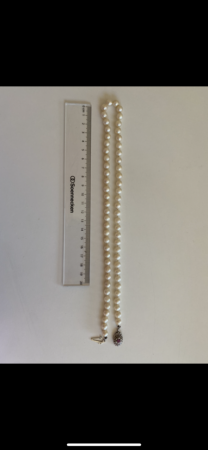 Perlenkette mit Prägung / Schätzwert